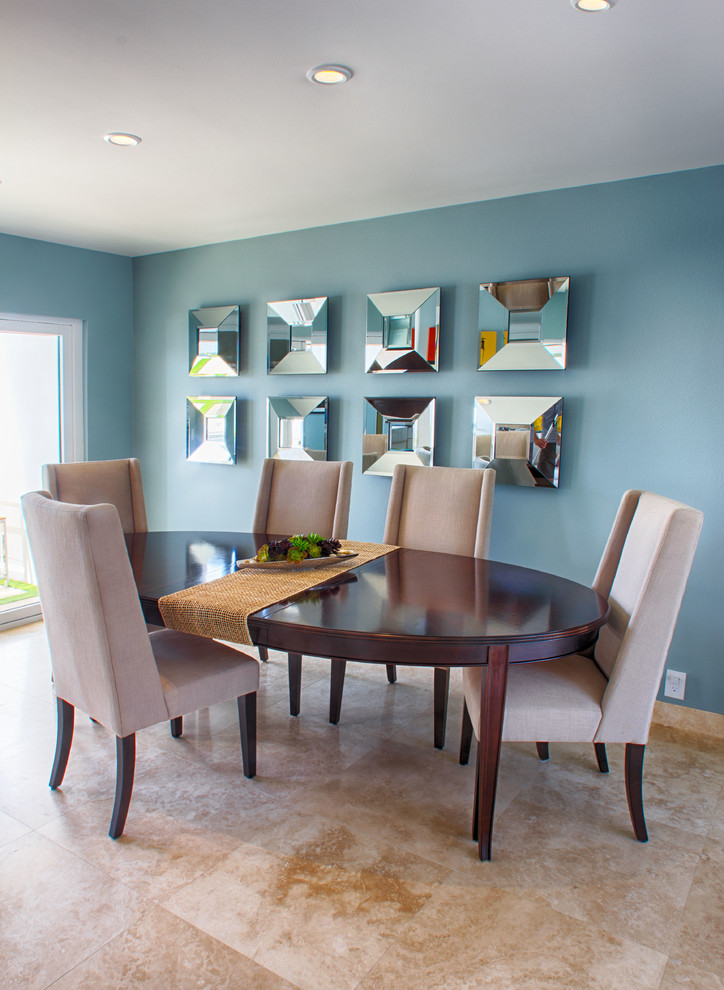 Photo of a transitional dining room in Other with blue walls.