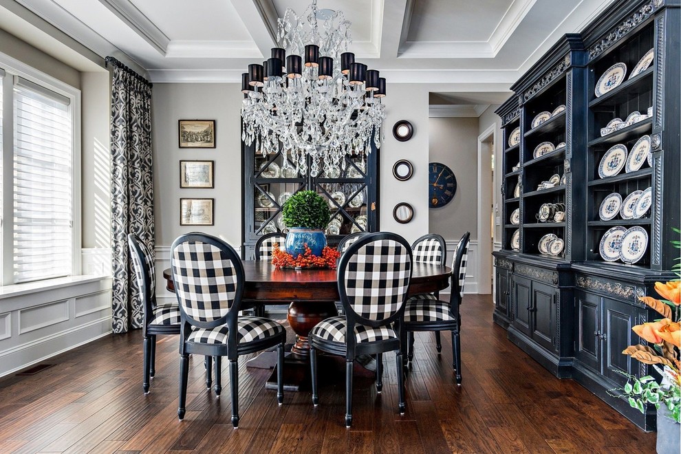 Photo of a mid-sized traditional separate dining room in New York with grey walls, medium hardwood floors and brown floor.