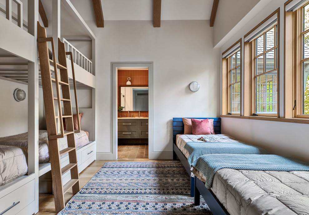 Kids' room - transitional light wood floor, beige floor and vaulted ceiling kids' room idea with white walls