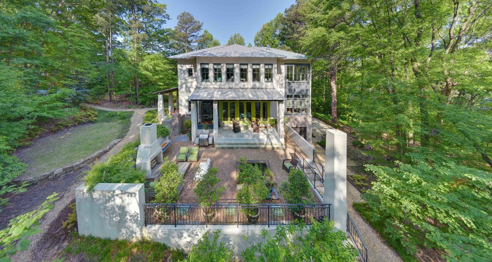 This is an example of a mid-sized modern three-storey stucco white exterior in Atlanta.