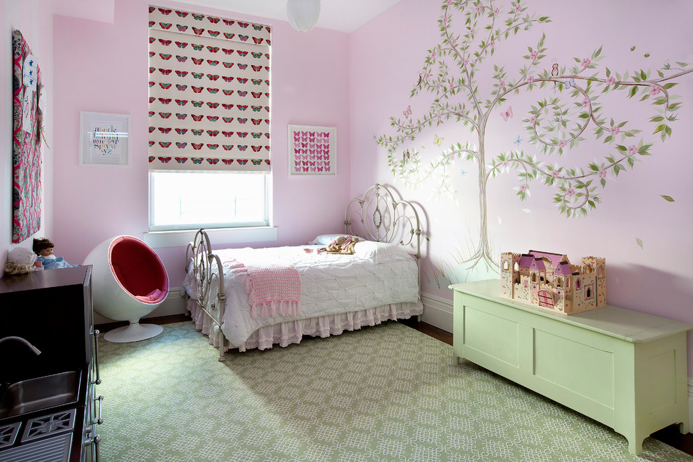 Inspiration for a mid-sized contemporary kids' bedroom for kids 4-10 years old and girls in New York with pink walls.