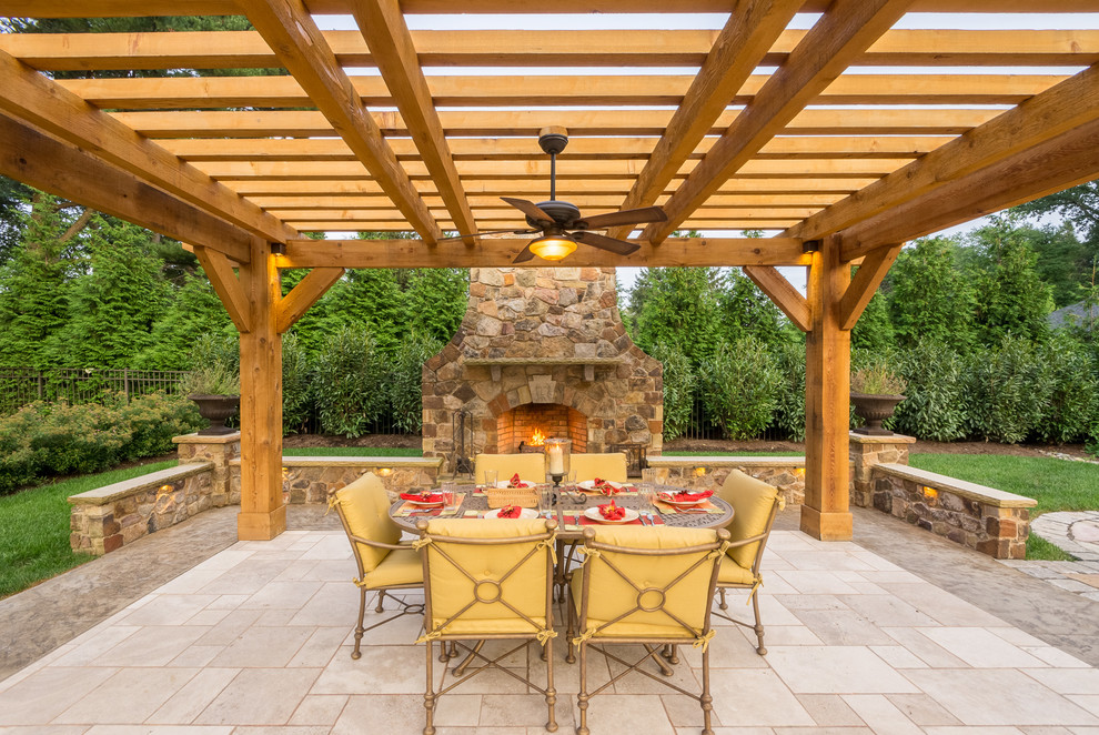 Photo of a country patio in Wilmington with an outdoor kitchen and a pergola.