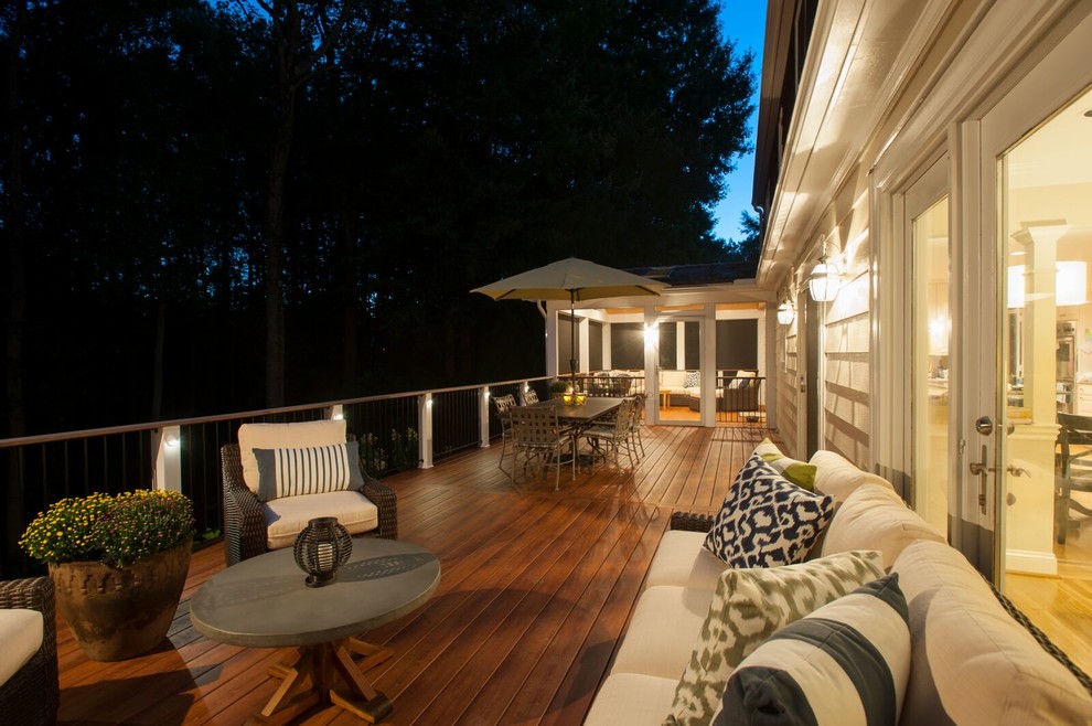 Photo of a large transitional backyard deck in DC Metro with no cover.