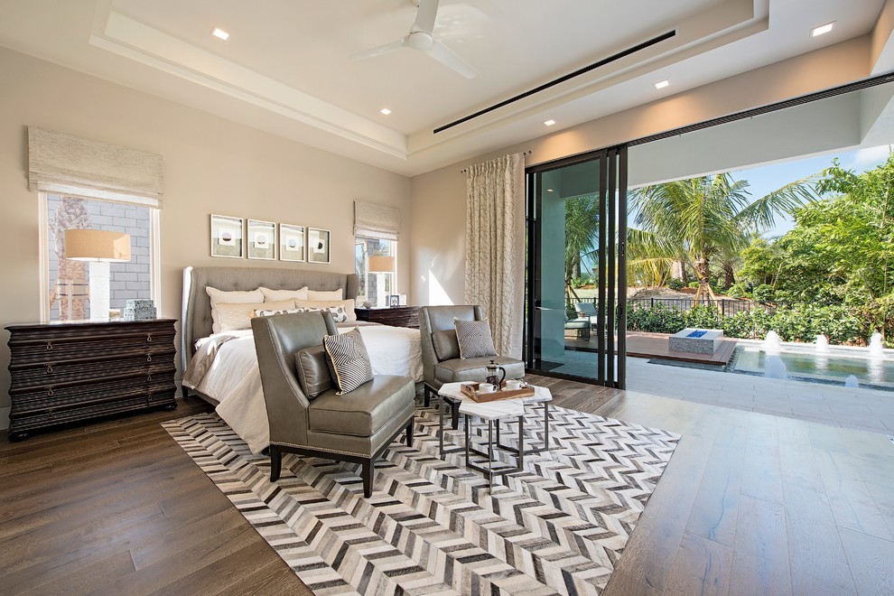Design ideas for a mid-sized transitional master bedroom in Miami with grey walls, medium hardwood floors and no fireplace.