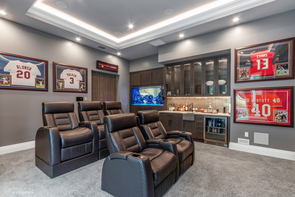 Inspiration for a mid-sized enclosed home theatre in Tampa with grey walls, carpet, a wall-mounted tv and grey floor.