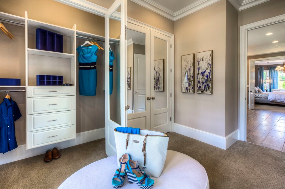 Photo of a traditional dressing room in Atlanta with white cabinets.