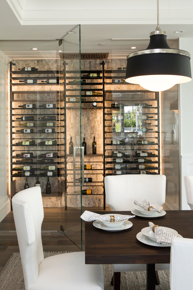 Design ideas for a small contemporary wine cellar in Los Angeles with medium hardwood floors, display racks and grey floor.