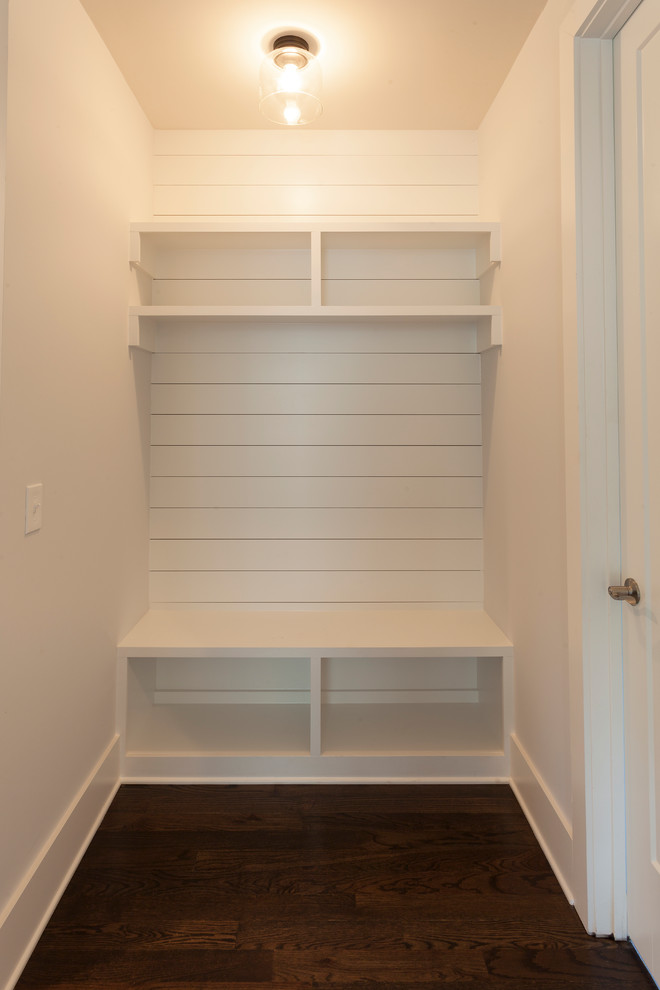This is an example of a mid-sized transitional mudroom in Nashville with white walls, dark hardwood floors, a single front door, a white front door and brown floor.