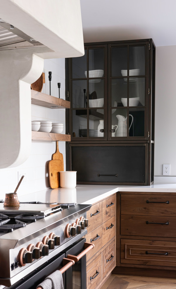 Mid-sized l-shaped eat-in kitchen in San Francisco with a farmhouse sink, flat-panel cabinets, quartz benchtops, white splashback, porcelain splashback, panelled appliances, medium hardwood floors, with island, brown floor, white benchtop, vaulted and medium wood cabinets.