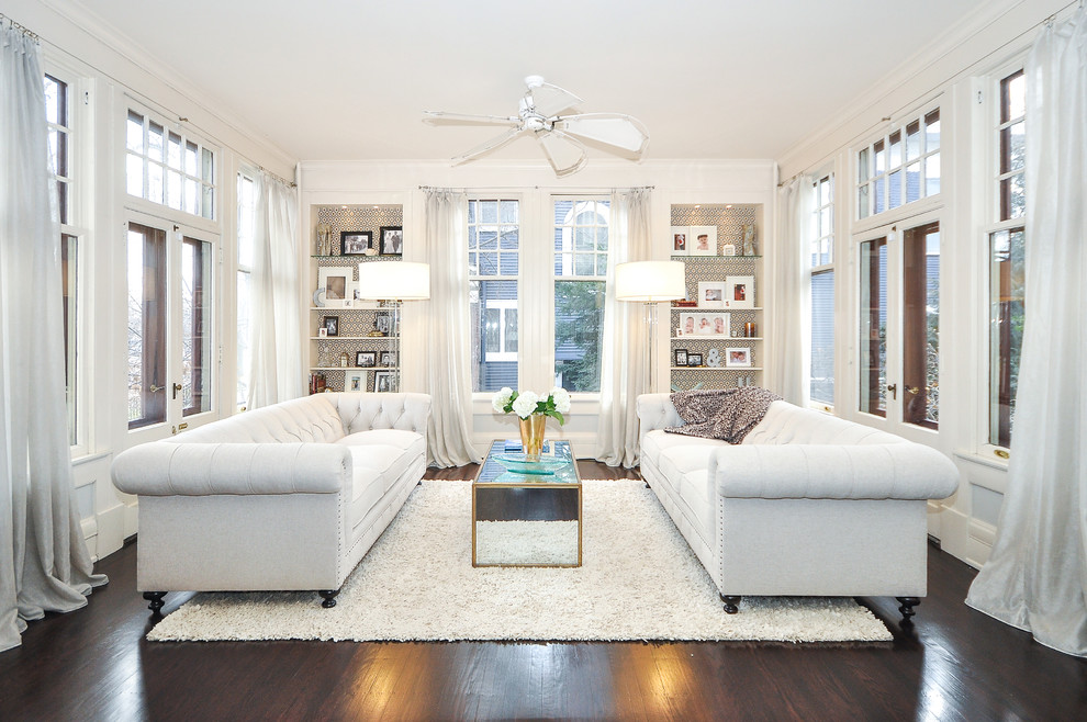Example of a transitional dark wood floor living room design in Minneapolis with white walls