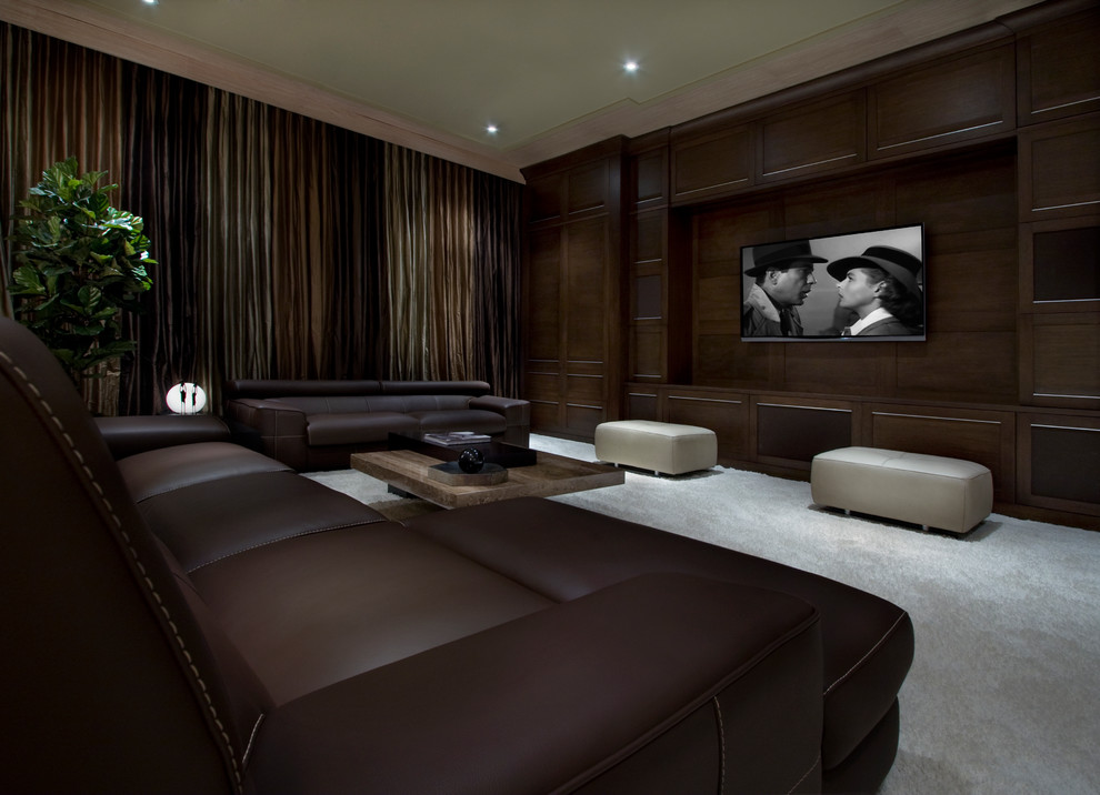 Inspiration for a transitional home theatre in Orlando with carpet and grey floor.