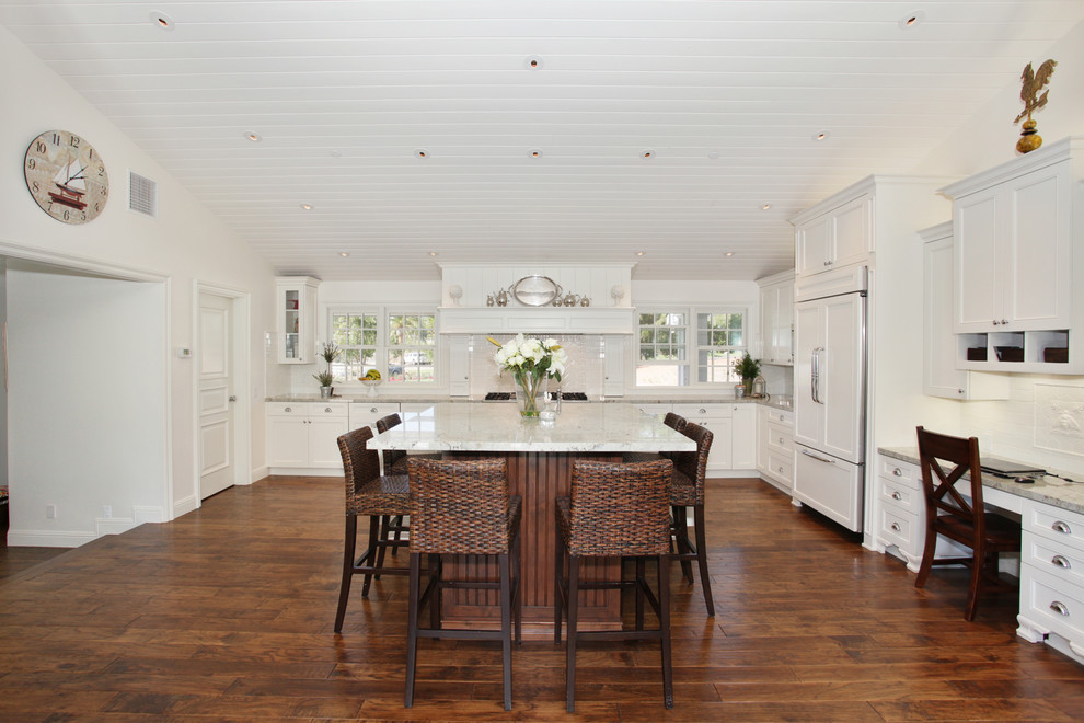 Traditional kitchen in San Diego with recessed-panel cabinets, white cabinets and panelled appliances.