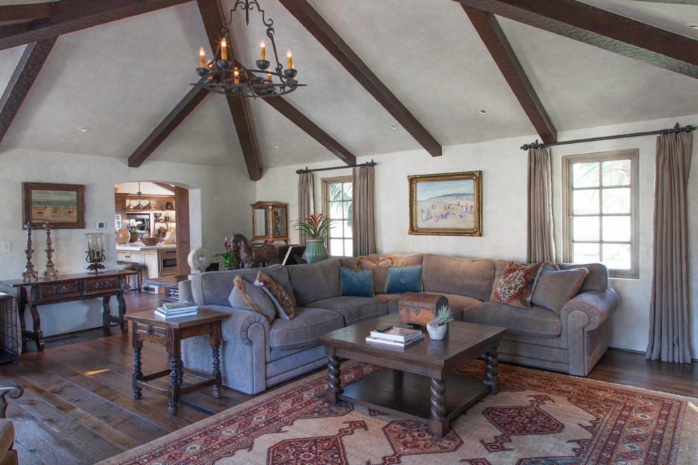 Example of a tuscan family room design in San Diego