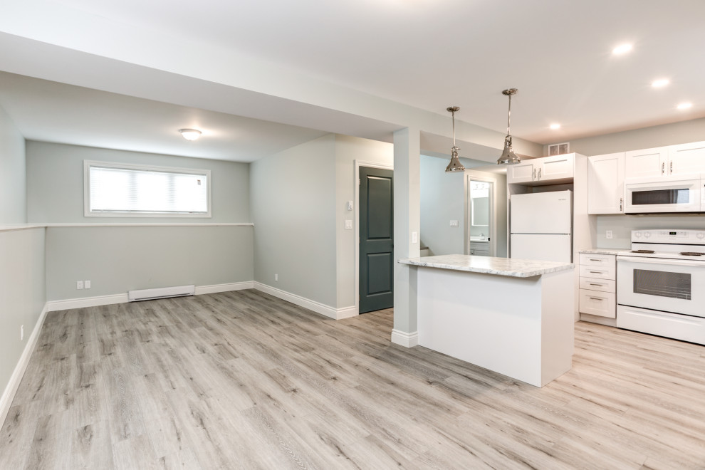 Inspiration for a mid-sized modern vinyl floor and gray floor dining room remodel with green walls