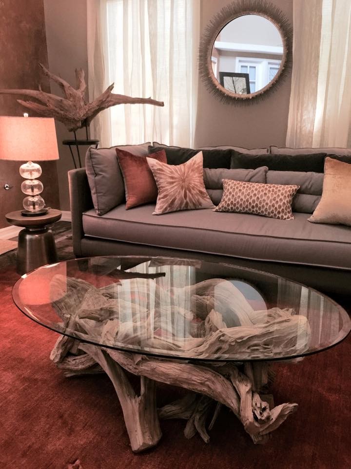 This is an example of a beach style living room in Los Angeles with grey walls and carpet.