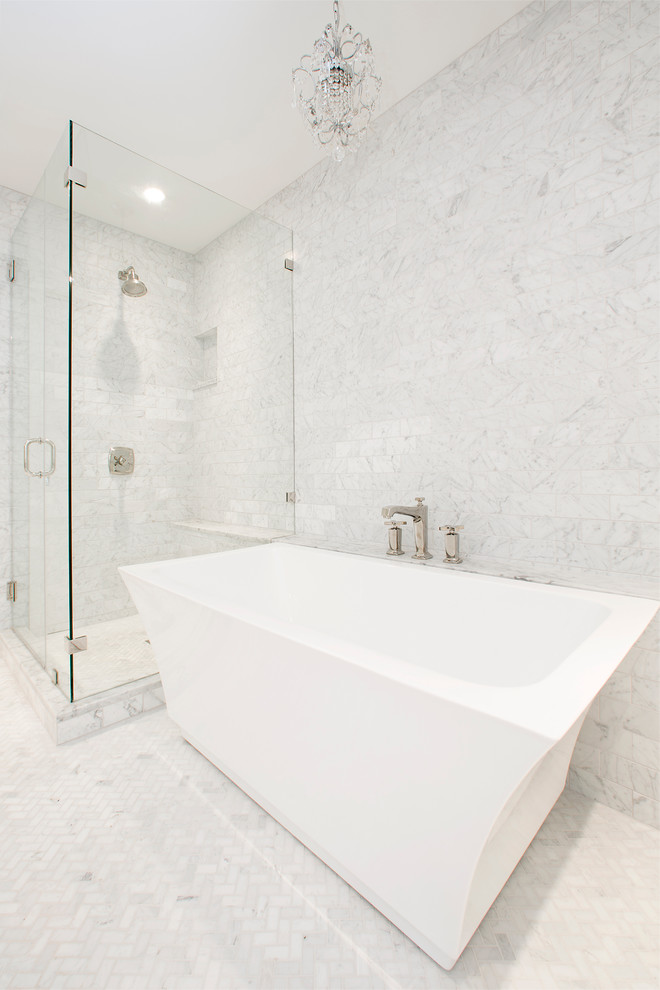 Photo of a large transitional master bathroom in Austin with a freestanding tub, shaker cabinets, white cabinets, marble benchtops, white walls, marble floors, a corner shower, marble, white floor and a hinged shower door.