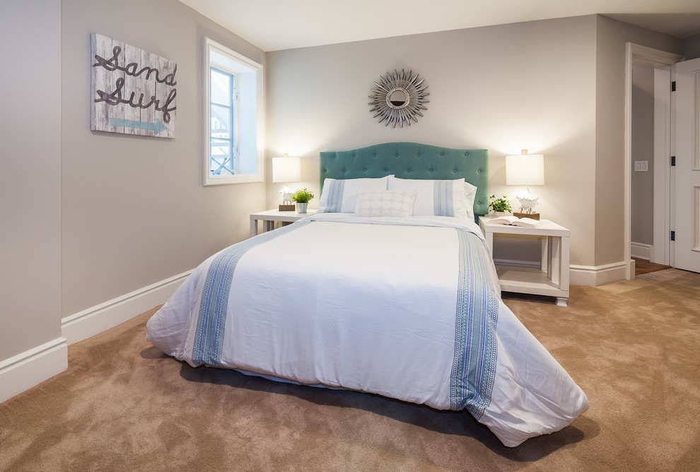 This is an example of a small beach style guest bedroom in Sacramento with grey walls, carpet, no fireplace and beige floor.