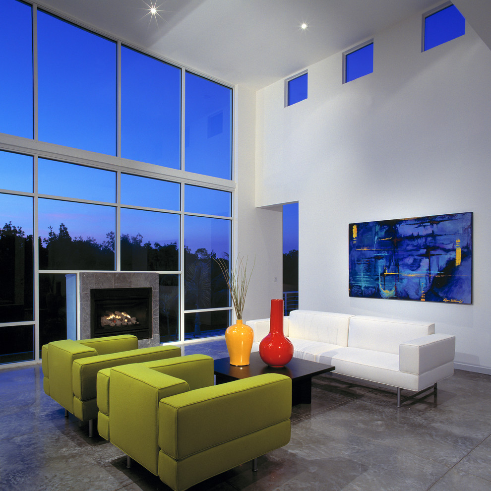 Inspiration for a contemporary formal living room in Tampa with white walls and a standard fireplace.