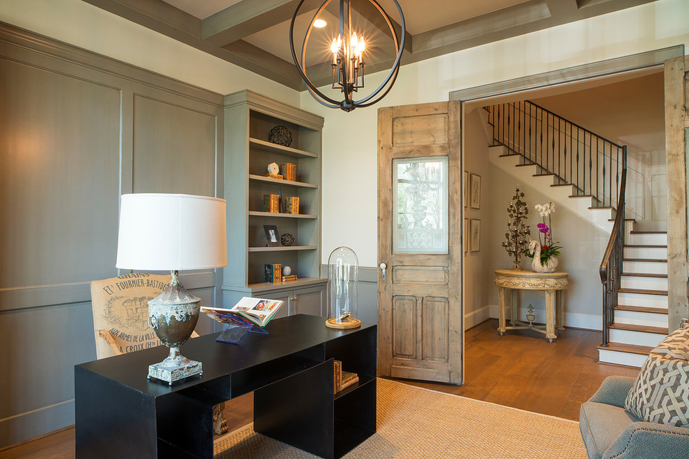 Inspiration for a country study room in Houston with grey walls, medium hardwood floors and a freestanding desk.