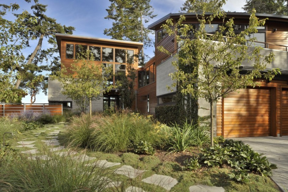 This is an example of a large contemporary two-storey brown exterior in Seattle with wood siding.