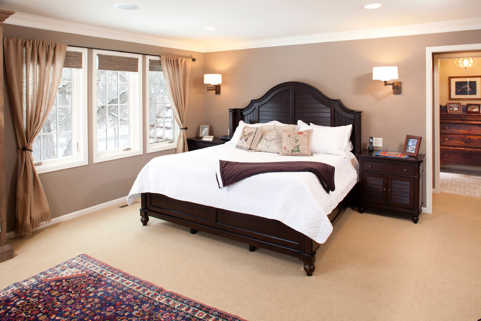 Large traditional master bedroom in Minneapolis with grey walls and carpet.