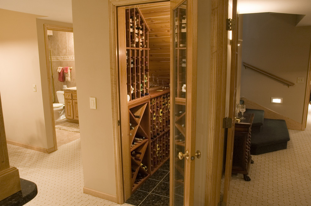Photo of a small traditional wine cellar in Minneapolis with ceramic floors and display racks.