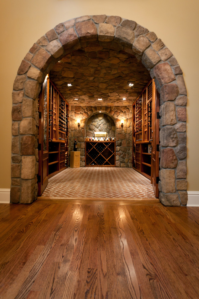 Inspiration for a large contemporary wine cellar in New York with brick floors and storage racks.