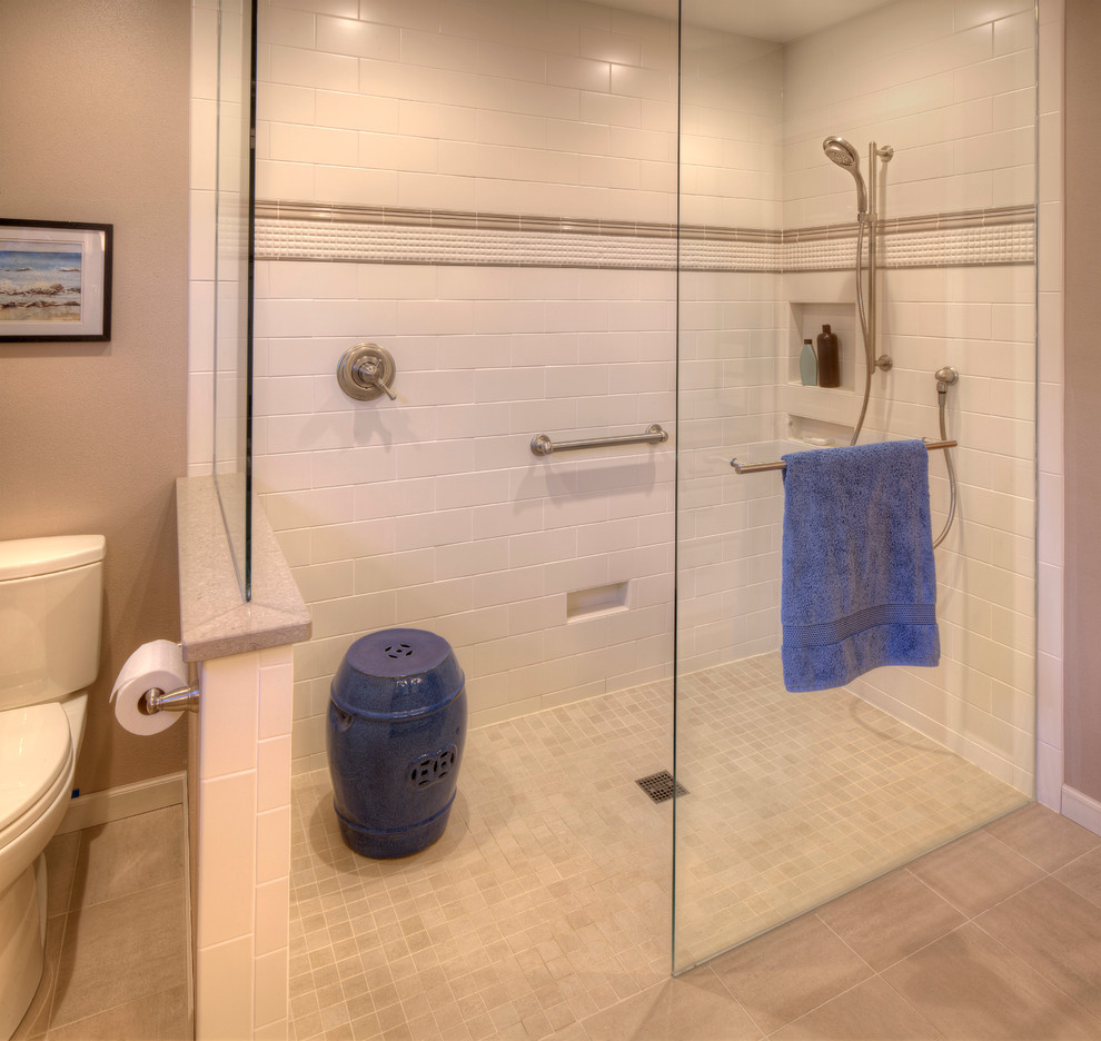 This is an example of a large modern master bathroom in Milwaukee with raised-panel cabinets, white cabinets, an open shower, a two-piece toilet, beige tile, ceramic tile, beige walls and ceramic floors.