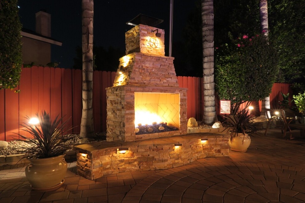 Photo of a traditional backyard full sun garden in Los Angeles with brick pavers.