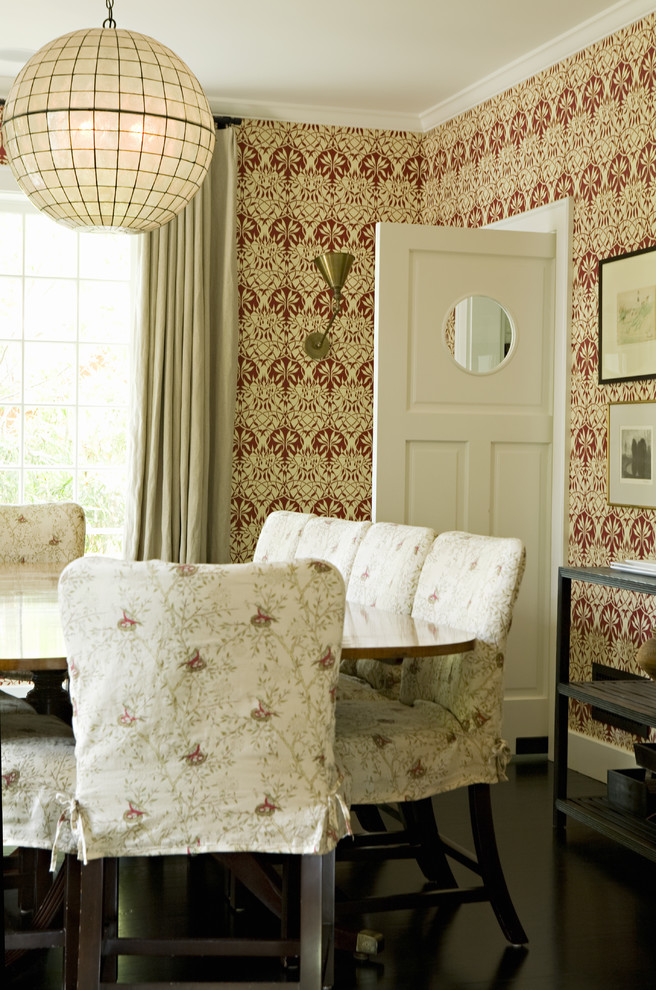 This is an example of a transitional dining room in Los Angeles with multi-coloured walls and dark hardwood floors.