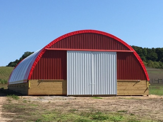 Mid-sized transitional red one-story metal exterior home photo with a shed roof