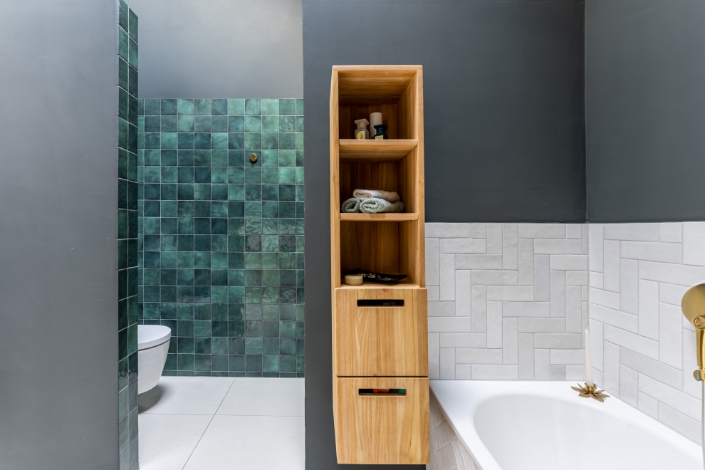 Medium sized contemporary bathroom in Frankfurt with medium wood cabinets, a corner bath, a walk-in shower, a wall mounted toilet, green tiles, ceramic tiles, green walls, ceramic flooring, a vessel sink, wooden worktops, beige floors, an open shower, brown worktops, a single sink and a floating vanity unit.