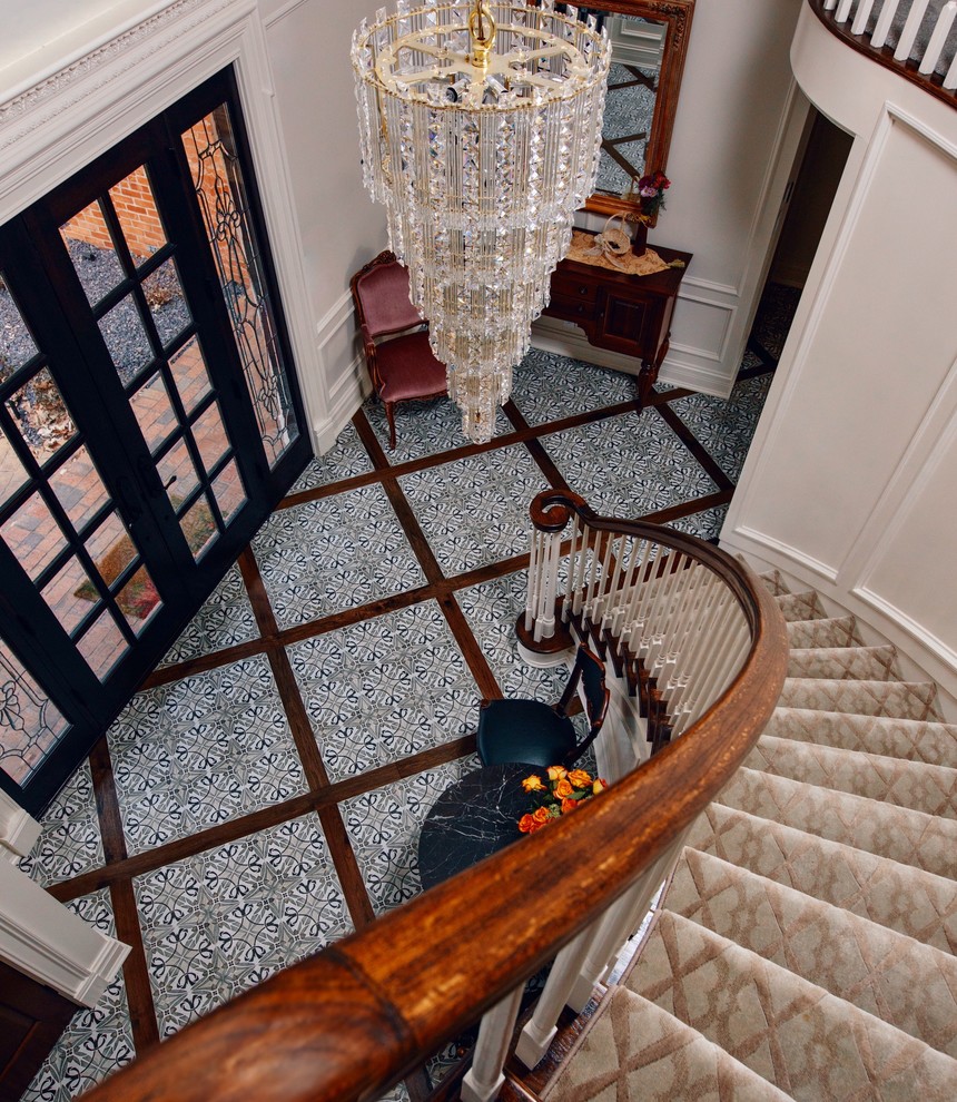 Foyer - mid-sized ceramic tile foyer idea in Chicago with white walls and a black front door