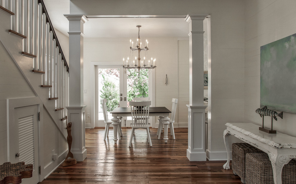 Transitional medium tone wood floor foyer photo in Miami with white walls