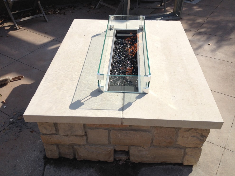 Inspiration for a mid-sized contemporary backyard patio in Minneapolis with a fire feature and no cover.