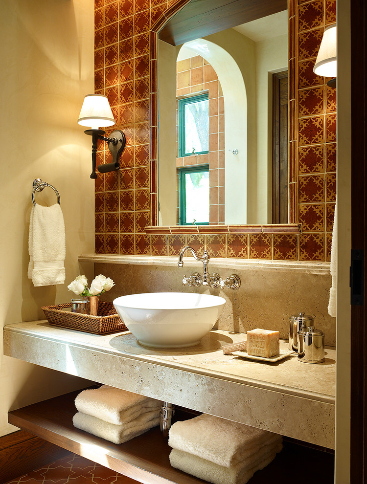 Mid-sized mediterranean master bathroom in San Francisco with a vessel sink, open cabinets, multi-coloured tile, beige walls, ceramic tile, terra-cotta floors and solid surface benchtops.