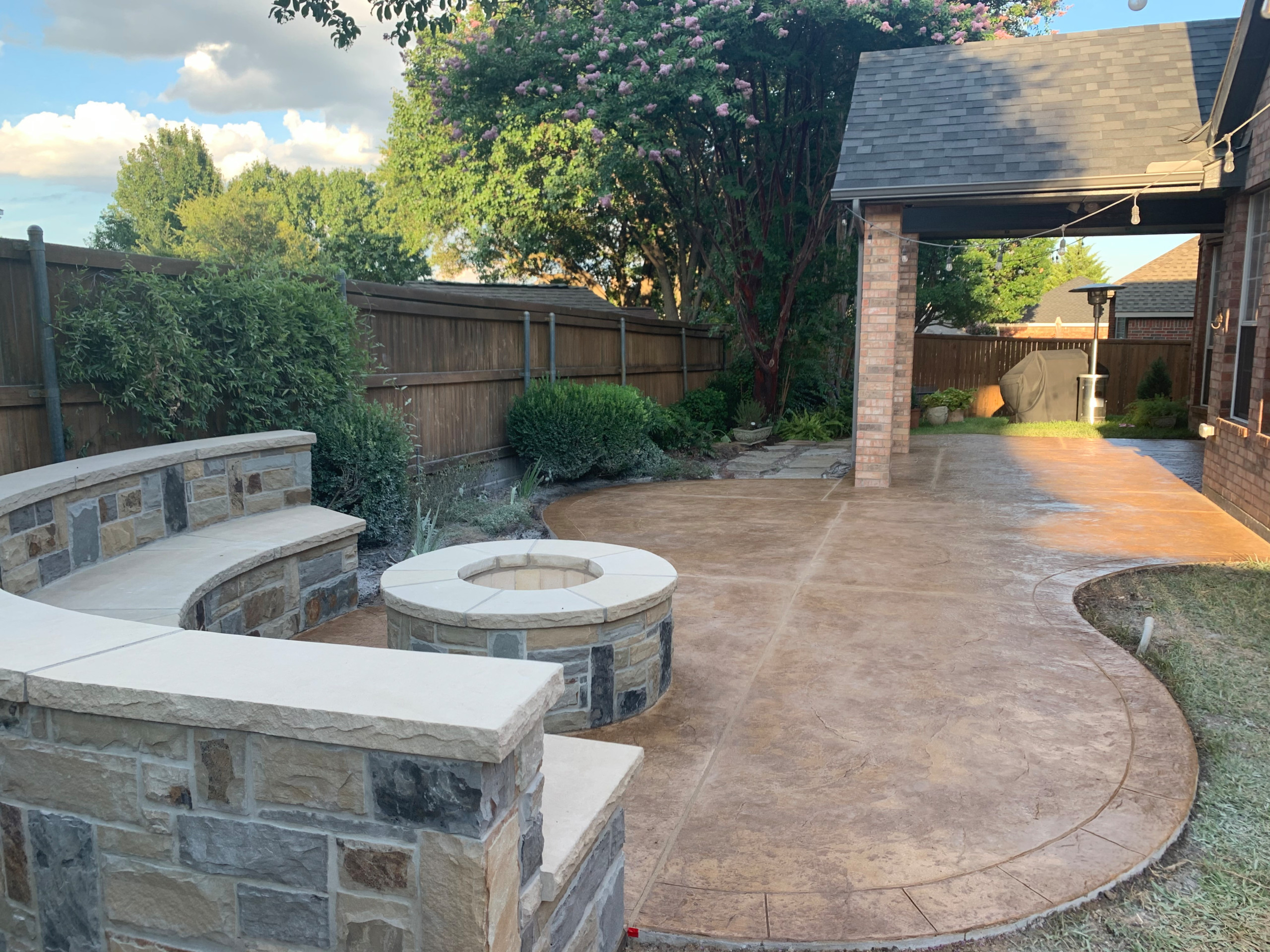 Stone benches, fire pit and stamped concrete