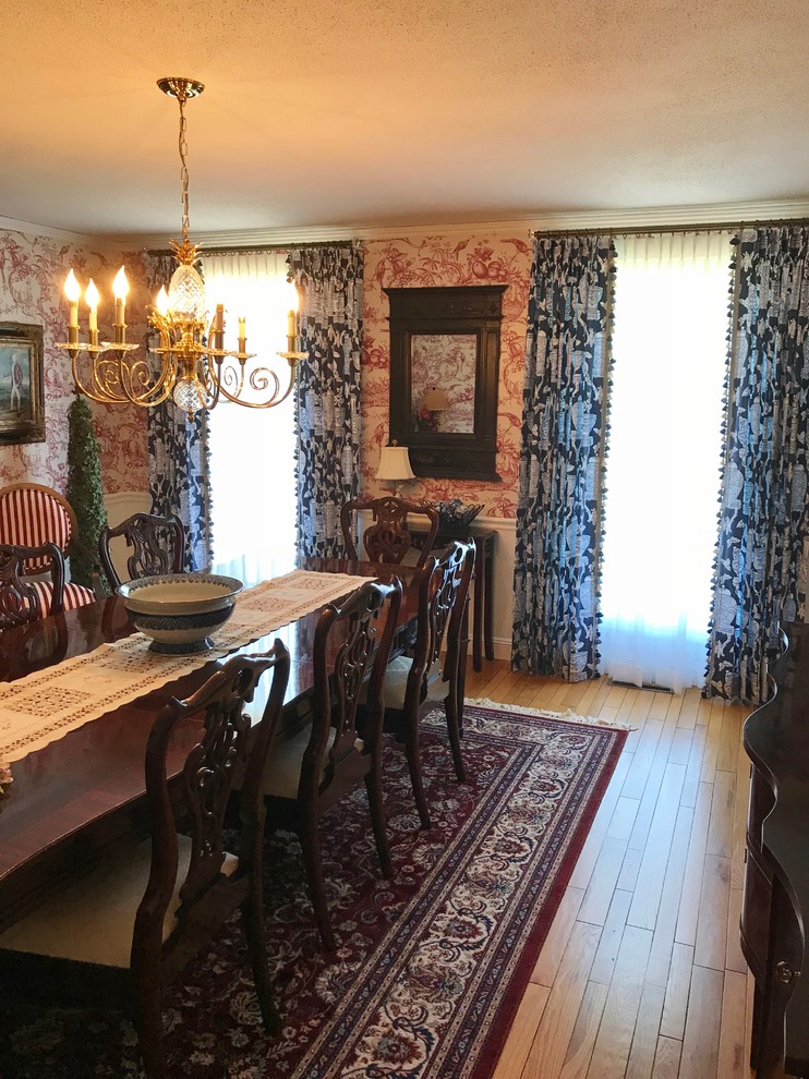 Design ideas for a large traditional dining room in New York with light hardwood floors, a brick fireplace surround, beige floor, no fireplace and multi-coloured walls.