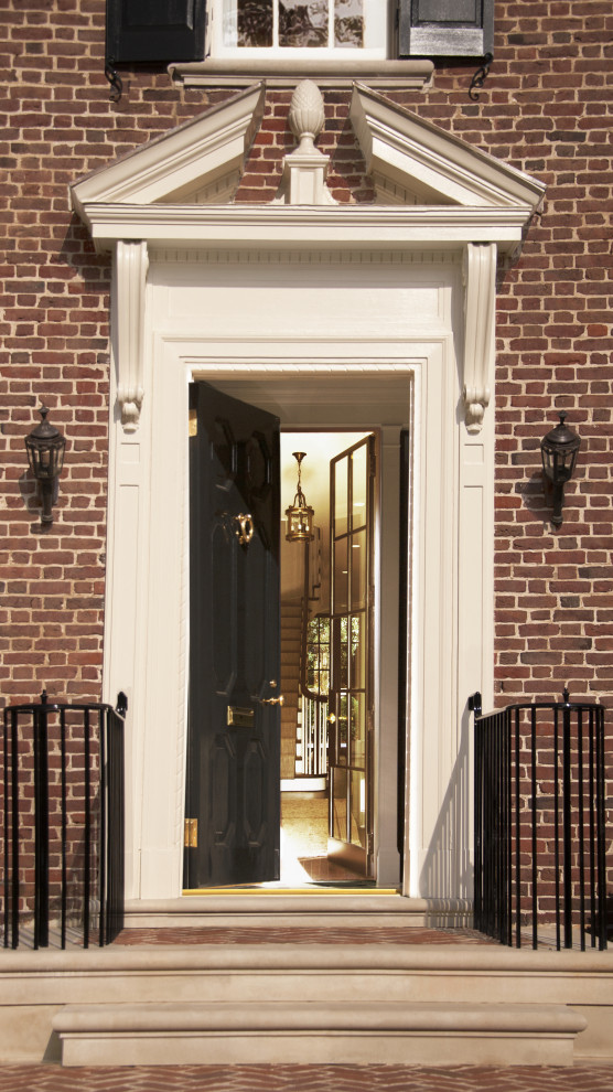 Design ideas for a mid-sized traditional front door in DC Metro with a single front door and a black front door.