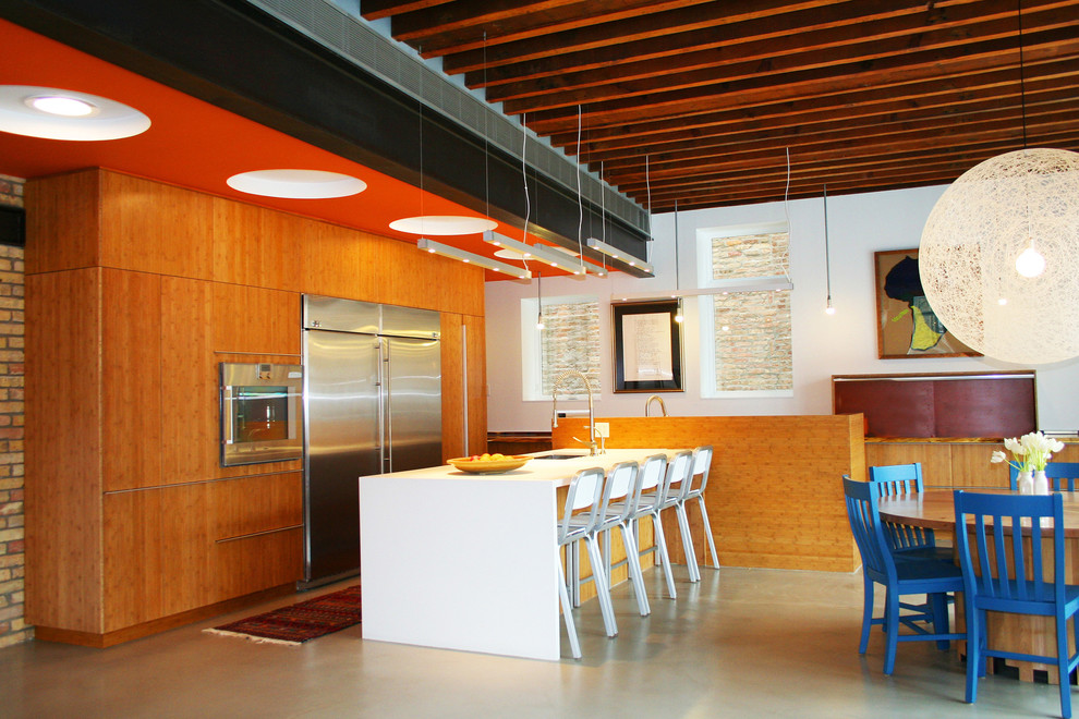 Design ideas for an industrial kitchen in Chicago with stainless steel appliances.