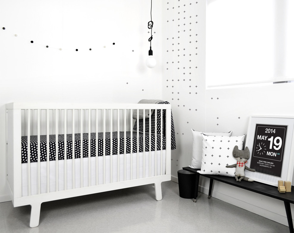 Design ideas for a modern gender-neutral nursery in Sacramento with white walls.