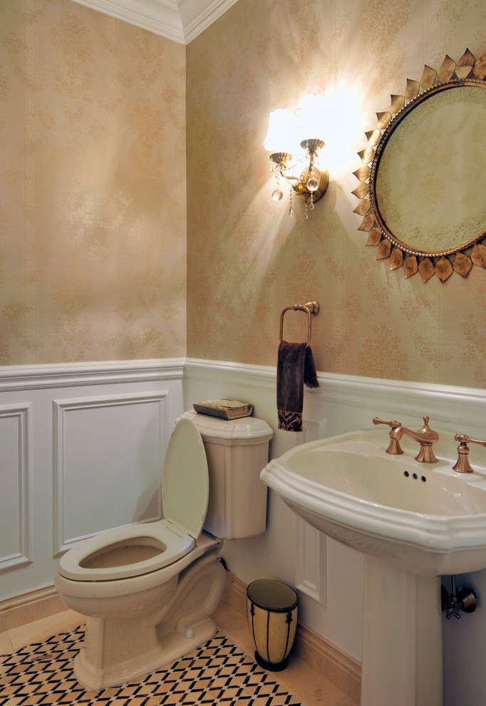 This is an example of a traditional bathroom in New York with beige tile, stone tile and marble floors.