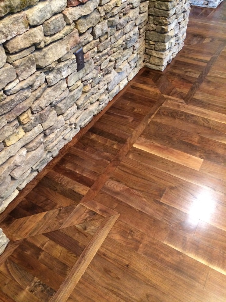 Huge transitional loft-style dark wood floor foyer photo