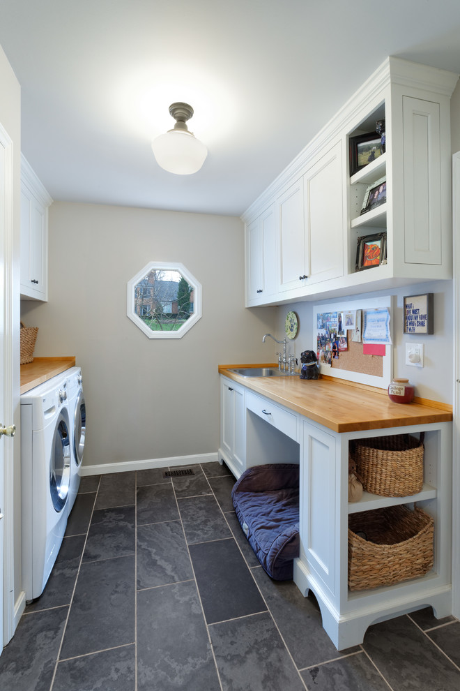 This is an example of a transitional laundry room in Cincinnati.