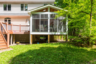 Screened-In Porch With Woodland Views Bridges the Seasons (13 photos)