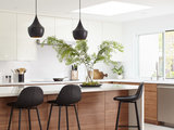 Midcentury Kitchen by Baron Construction & Remodeling Co.