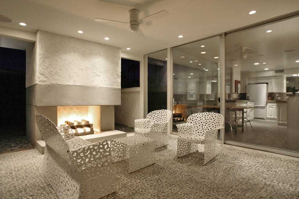 Inspiration for a midcentury patio in Los Angeles with a fire feature.