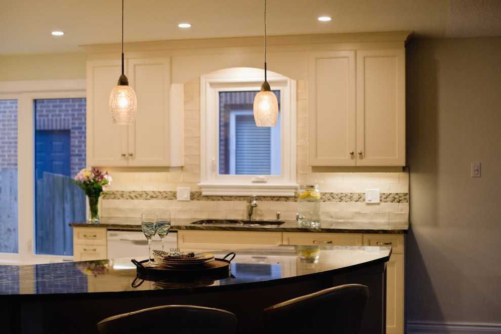 Example of a mid-sized transitional ceramic tile eat-in kitchen design in Ottawa with granite countertops, ceramic backsplash and an island