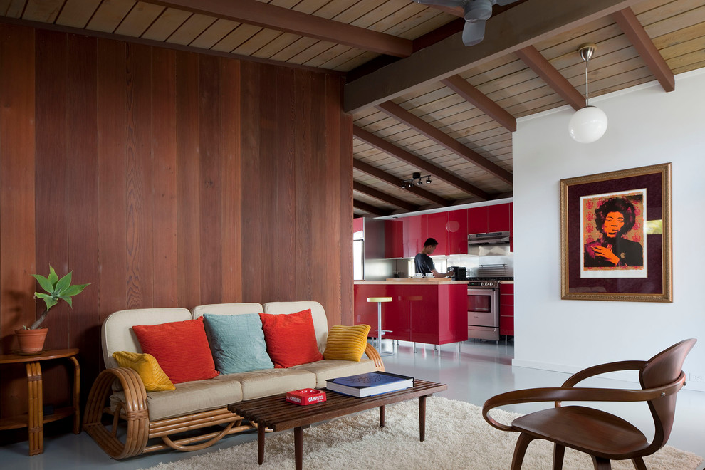 Mid-sized midcentury open concept living room in Hawaii with white walls, concrete floors and no fireplace.