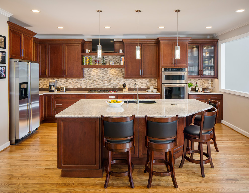 Example of a large transitional l-shaped light wood floor and beige floor eat-in kitchen design in Atlanta with an undermount sink, shaker cabinets, medium tone wood cabinets, granite countertops, gray backsplash, matchstick tile backsplash, stainless steel appliances and an island